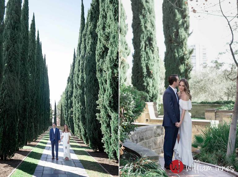 Standing in tress during a Greystone Mansion Engagement session