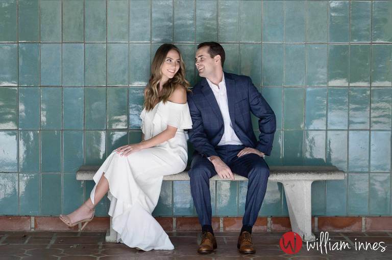 Couple sitting on a bench at a Greystone Mansion Engagement session