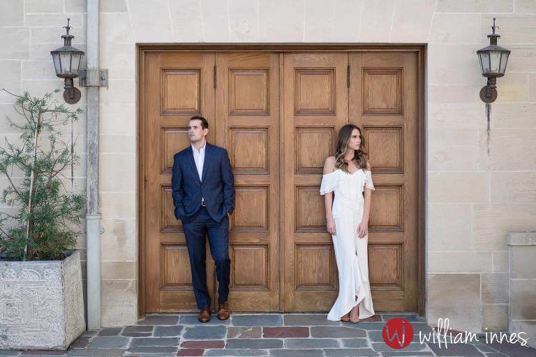 Man and women standing by door at a Greystone Mansion Engagement session